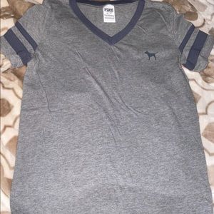 Gray V-neck with PINK logo on back.